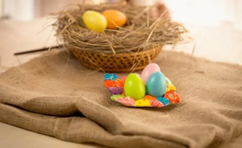Traditional eggs lying on table at Easter Stock Photos
