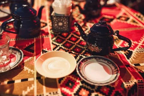 Traditional egyptian tea ceremony with patterned tablecloth Stock Photos