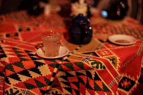 Traditional egyptian tea ritual with patterned tablecloth Stock Photos
