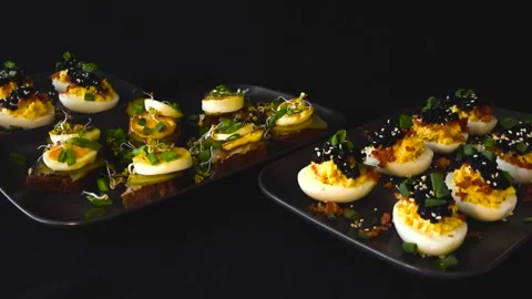 Traditional Estonian Appetizers Deviled Eggs With Caviar And Sprat Rye Bread Stock Footage 332032407