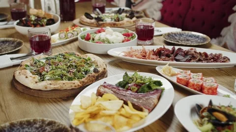 Traditional Feast with Assorted Dishes on Table Stock Footage 301531895