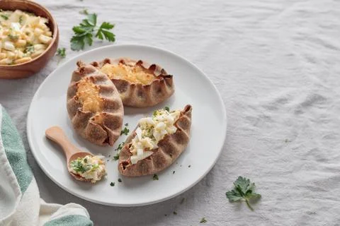 Traditional Finnish pastry - Karelian rye pie with rice porridge and eggbutte Stock Photos