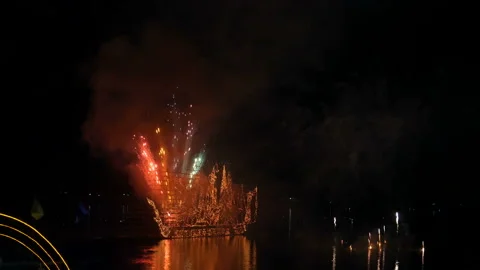 Traditional fire boat floating with firework in Mekong river at night Stock Footage 136319152