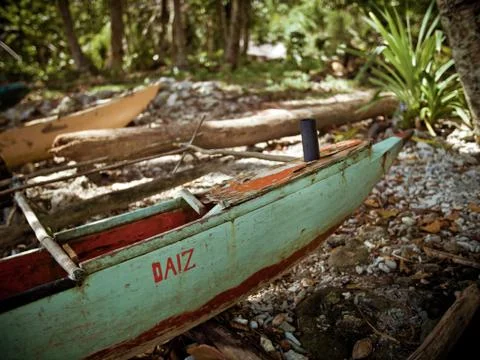 TRADITIONAL FISHING BOAT RESTING ON SHORE, PAPUA NEW GUINEA Stock Photos