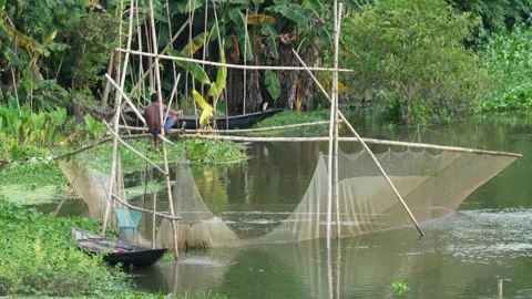 A traditional fishing method using in a river Stock Footage 316233131