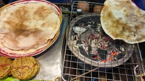 Traditional Flatbread Roasting Over Charcoal With Fresh Stack Video stock 329370008