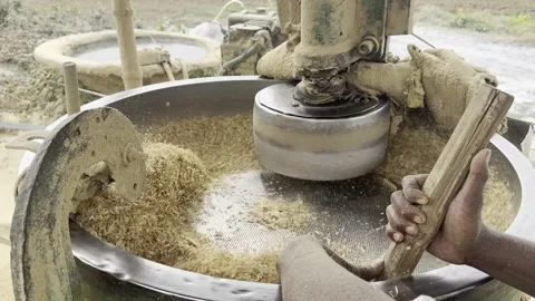 Traditional flour mill grinding wheat grain in rural Indian village Video stock 344099415