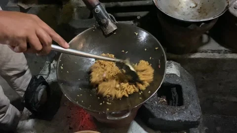 Traditional fried rice cooking process by street vendor. Frying rice with s.. Stock Footage 293141406