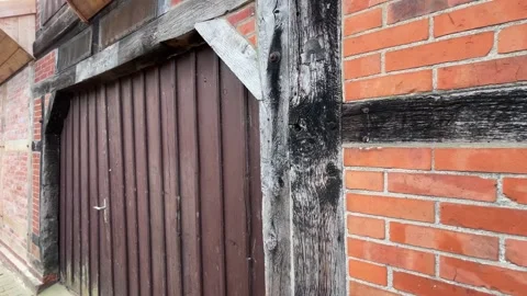 Traditional German Half Timbered House Exterior with Wooden Garage Door Stock Footage 341281252