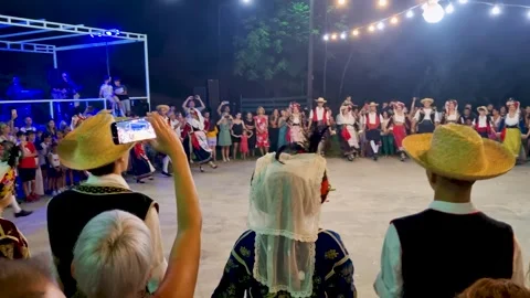 Traditional Greek Folk Dance Performance in Circle at Night Festival, Agrafi Stock Footage 336419986