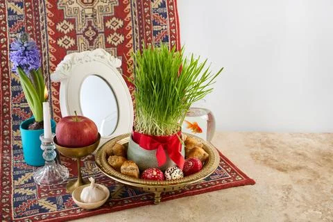 Traditional haft-sin table setting celebrating nowruz spring Stock Photos
