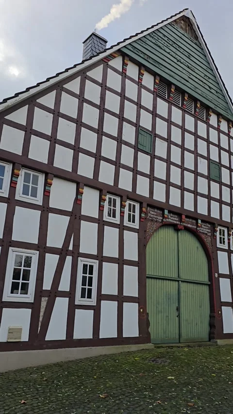 Traditional Half Timbered House Facade with Green Wooden Gate 스톡 동영상 340336466