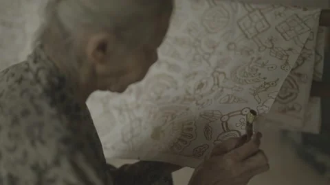 Traditional Hand Made Batik Making Process Old Woman in Yogyakarta, Indonesia Stock Footage 194997608