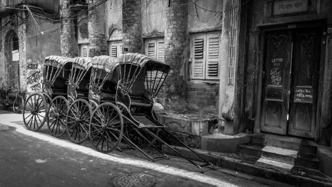 Traditional hand pulled indian rickshaw on the street of Kolkata Stock Photos