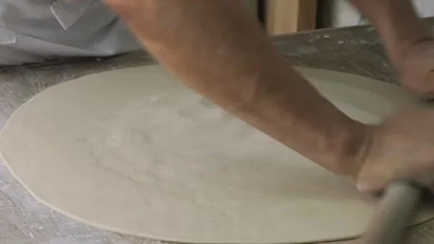 Traditional Hand-Rolling Process for Dough Preparation Stock Footage 333522787