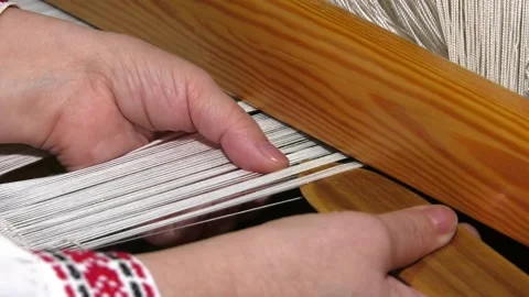 A traditional hand-weaving loom being used to make cloth Video stock 106774878