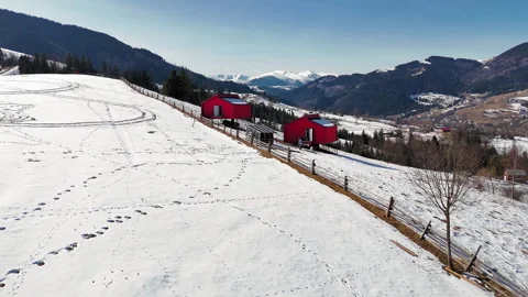 Traditional haystack in snowy Carpathian hillside landscape, rural winter scene Video stock 308488623