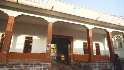 Traditional Home with Temple Backdrop Stock Footage 325090727