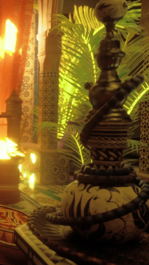 Traditional hookah setup in an indoor space with plants and warm lighting Stock Footage 334110411