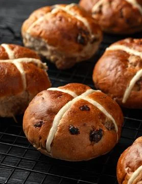 Traditional Hot Cross Buns. Easter Sweet Rolls with Spices and Dried Fruit Stock Photos