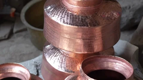 Traditional Indian Copper Pots Displayed in Market for Kitchen Use Stock Footage 333069916