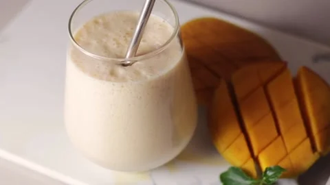 Traditional Indian drink lassie with mango. Milk, yogurt, mango Stock Footage 170452020