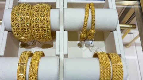 Traditional indian gold bangles display in jewelry store showcase Stock Footage 331795994