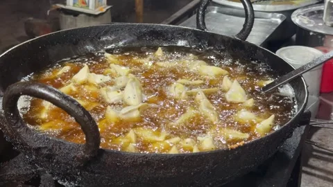 Traditional Indian Samosas (Singara) Deep Frying in Hot Oil at Street Food Stall Video stock 339264113