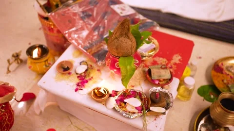 Traditional Indian Wedding Puja Setup with Coconut and Diyas Stock Footage 345718080