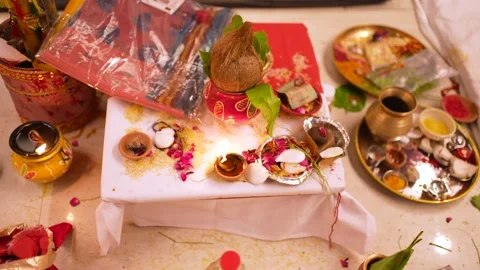 Traditional Indian Wedding Ritual Setup with Coconut and Diya Stock Footage 345718079