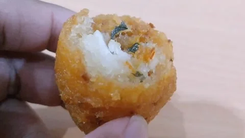 Traditional Indonesian Combro Cut in Half Showing Spicy Oncom Filling Stock Footage 340376441