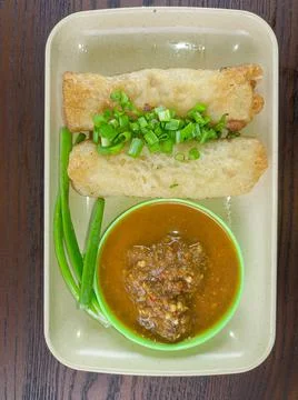 Traditional Indonesian snack food. Risoles eaten with green chili sauce Stock Photos