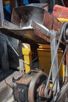 Traditional Industrial Machine Processing Material in Rustic Workshop Stock Photos