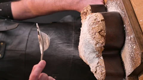 Traditional Italian desserts for Easter - Easter dove . A man sprinkles icing su Video stock 149611039