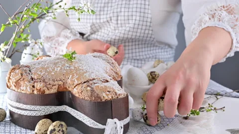 Traditional Italian desserts for Easter - Easter dove. Woman in smart clothes Stock Footage 149747413
