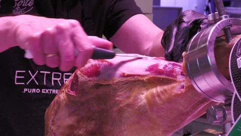 Traditional Jamon Serrano Being Sliced at Market in Malaga Stock Footage 336025223