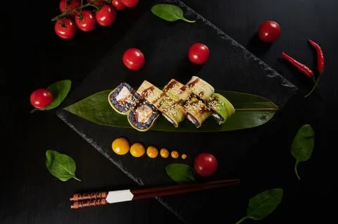 Traditional Japanese food - sushi, rolls and sauce on a black background. Top Stock Photos