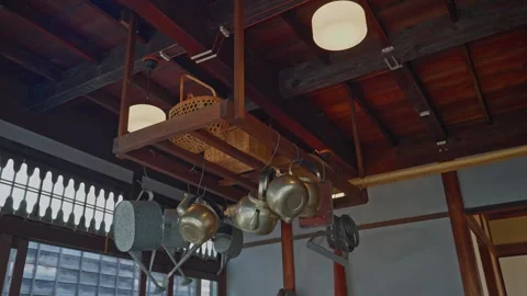 Traditional Japanese Kitchenware Hanging from Ceiling in Historic Shop Stock Footage 331324894