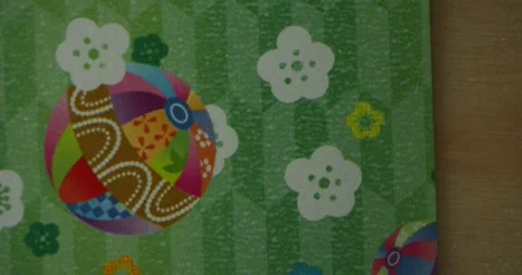 Traditional Japanese Patterns with Temari Ball Coming Into Focus Stock Footage 344712119