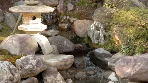Traditional Japanese Stone Lantern by a Stream in Nagamachi Samurai District Stock Footage 336520000