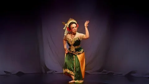Traditional Javanese Dancer Performing Expressive Hand Gesture in Studio Stock Photos