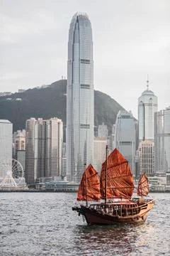 Traditional junk boat at Victoria Harbour in Hong Kong Stock Photos