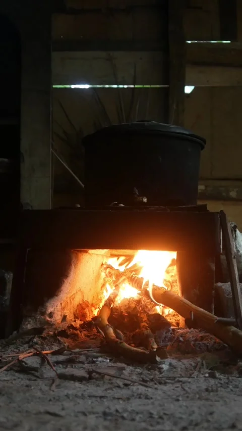Traditional kitchen with a burning wood burning stove Stock Footage 316923480