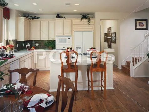Traditional Kitchen With Island And Dining Table