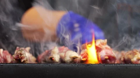 Traditional Korean bbq, Chinese meat skewers on bamboo sticks, close-up. Beef Stock Footage 303351663