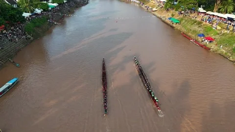 Traditional Long Boat Racing on a River in Luang Prabang, Laos Stock Footage 345596367