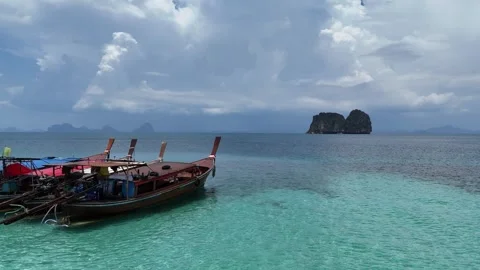 Traditional Long Tail Boats Drifting on a Calm Tropical Sea in Ko Ngai, Thailand Stock Footage 335955053