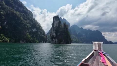 Traditional Longtail Boat Approaching Limestone Karsts Stock Footage 329072874