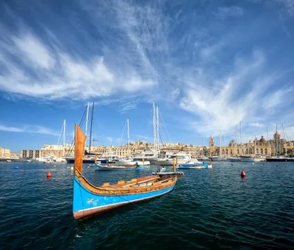 Traditional luzzu in Birgu harbour, Malta Stock Photos