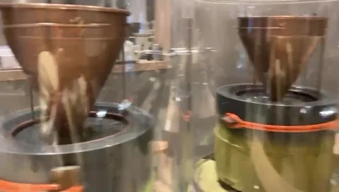 Traditional Matcha Grinding with an Automatic Stone Mill Stock Footage 311908599
